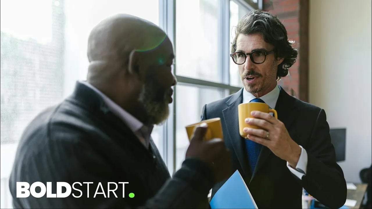 Two professionals discussing a certification program